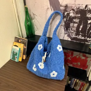 Blue fuzzy floral embroidered bucket bag, cozy knitted tote handbag for women commuting daily.