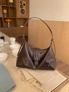 Vintage brown faux leather shoulder bag for women, retro chic underarm handbag for daily use.