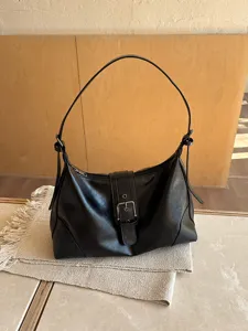Vintage black leather shoulder bag, trendy underarm hobo bag for women daily commute style.