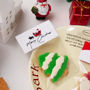 Christmas cookie packaging header card with transparent bag and cute holiday design for sweet treats.