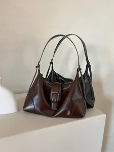 Vintage soft leather underarm shoulder bag for women, retro style casual daily handbag.