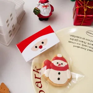 Christmas cookie packaging header card detail showing cute Santa design and clear pastry bag.