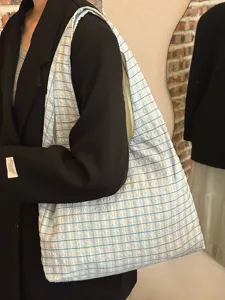 Detailed view of the Japanese vintage blue plaid canvas shoulder tote bag in daily scene.