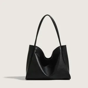 Classic black soft leather tote bag for women, minimalist large capacity shoulder bag for daily commute.