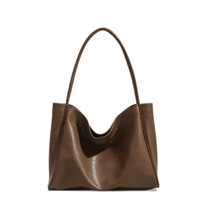 Minimalist brown soft leather tote bag for women, large capacity casual commute shoulder bag.