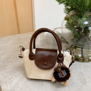 Fashionable contrast color small handbag for women, casual crossbody and top-handle bag.