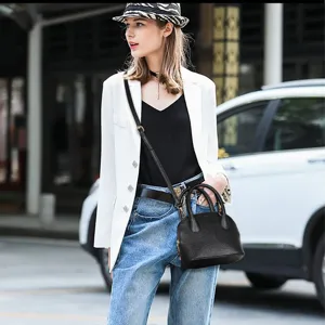 Classic black dome shoulder bag for women, trendy leather handbag with crossbody strap.