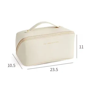 Large capacity PU leather makeup bag for women, portable travel cosmetic pouch with handle.