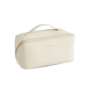 Large capacity PU leather makeup bag with handle and zipper for travel and daily organization.