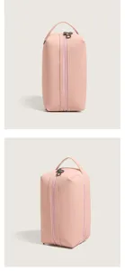 Detailed view of the minimalist pink PU cosmetic bag showing its dual zipper and handle.