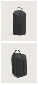 Detail close-up of the black minimalist storage bag, multi-compartment cosmetic pouch.
