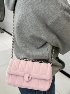 Pink quilted chain shoulder bag for women, stylish minimalist crossbody flap bag commuting.
