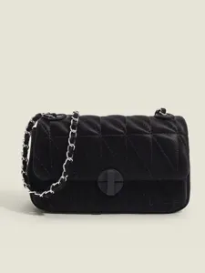 Black quilted chain shoulder bag, stylish flap crossbody bag with metal strap for women.
