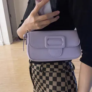 Chic purple underarm shoulder bag for women, minimalist solid color fashion crossbody bag.