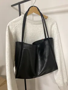 Classic black faux leather tote bag for women, large capacity minimalist shoulder bag commuting.