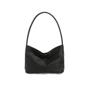 Minimalist black nylon underarm shoulder bag for women, casual trendy daily commuter handbag.