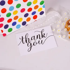 Minimalist white thank you greeting card for holiday gift packaging and message notes.