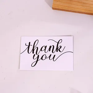 Detail shot of minimalist black and white thank you greeting card for packaging and gifts.