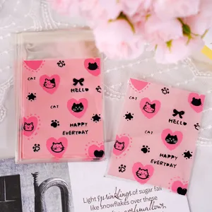 Pink cute cat heart pattern self sealing bags detailed view for small gift and cookie packaging.