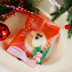 Christmas frosted cookie packaging bag detail view, cute snowman design, holiday festive supply