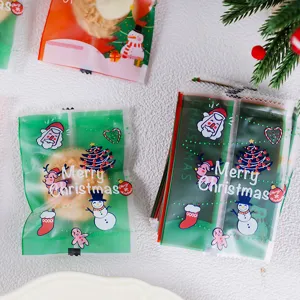 Christmas frosted machine sealed cookie packaging bags with cute cartoon Santa and elk designs.