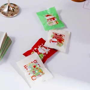 Christmas gift packaging bags for cookies, nougat, and candy with cute cartoon designs.
