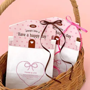 Sacchetti regalo in carta a forma di casa con nastri per confezioni biscotti caramelle