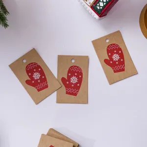 Kraft Christmas gift tags with red mitten snowflake print, DIY hanging labels for holiday decor.