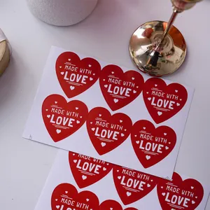 Red heart shaped sealing stickers with love text for gift packaging and decoration details.