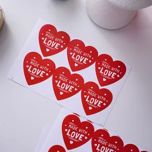 Red heart sealing stickers with 'MADE WITH LOVE' text, perfect for gift wrapping and decor.
