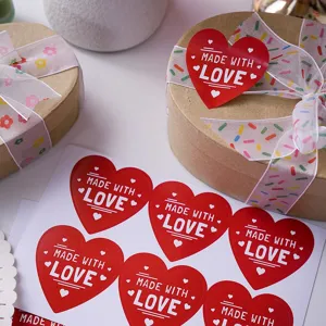 Red heart made with love sealing stickers, perfect for gift wrapping and party decor use.