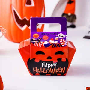 Detail shot of Halloween candy gift box with cute pumpkin face and festive text print.