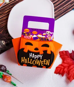Halloween pumpkin candy box detail featuring cute festive face design and handle.