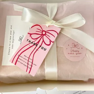 Gift wrapping set with thank you cards, ribbon and stickers for holiday packaging details.