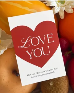 Valentine red heart greeting card with love you text for gift packaging and baking decor.