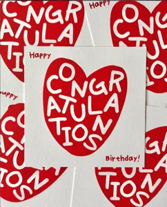 Square birthday greeting card with red heart design and congratulation text for gifts.