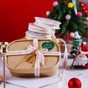 Christmas ribbon rolls with red Merry Christmas print for gift wrapping, crafts, and holiday decor.