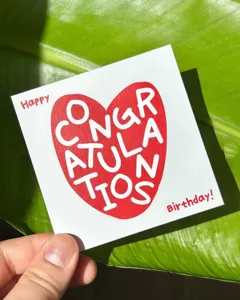 Square birthday greeting card with heart design, perfect for gift packaging and messages.
