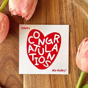 Square birthday greeting card with red heart design, ideal for gift wrapping and messages.