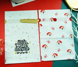 Christmas plastic candy gift bags detail view with cute Santa pattern and festive design.