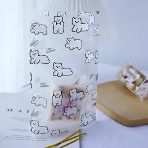 Frosted white self-standing bag with cute bear print, perfect for cookies and pastry storage.