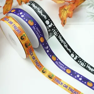 Halloween ribbon detail showing printed pumpkins and spooky text on colorful fabric rolls.