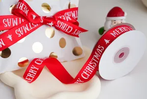 Christmas red ribbon with Merry Christmas print, ideal for gift wrapping and holiday decor.