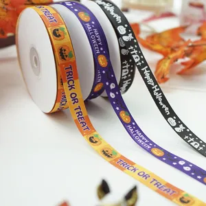 Halloween printed ribbon detail shot showing pumpkin and ghost patterns for gift wrapping.