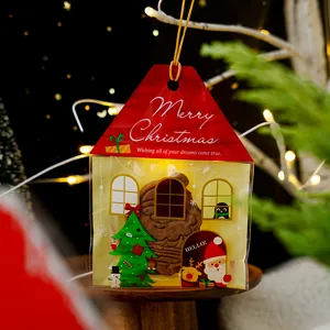 Detailed close-up shot of the Christmas house shaped packaging bag with festive decorations.