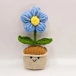 Detailed shot of handmade crochet plush flower in a cute potted design, soft yarn texture.