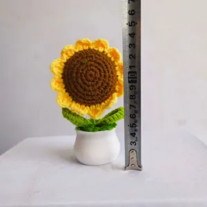 Handmade crochet sunflower potted plant detail view, perfect home decor and desktop ornament.