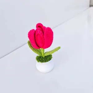 Detailed view of a handmade crochet tulip potted plant in a white vase, perfect decor.
