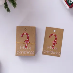 Christmas kraft paper tag detail view, showing candy cane print and festive design clearly.