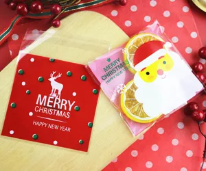 Christmas self-adhesive candy packaging bags, cute Santa and reindeer cookie bakery bags.